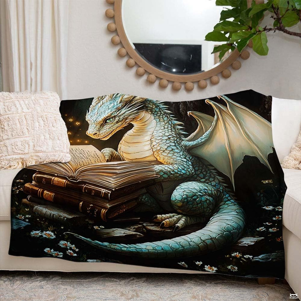 Close up of reading dragon throw blanket highlighting turquoise dragon scales and glowing embers