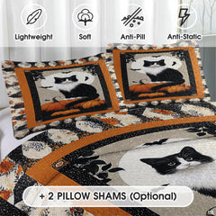 Close-up detail of black cat bedding displaying intricate feline illustration, swirling vines, and burnt orange pumpkins.