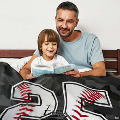 Artistic detail of dark bedding sets showcasing baseball texture and seam accents.