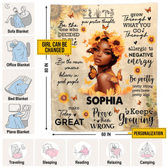 Inspirational sunflower woman blanket styled across a bedroom bed.