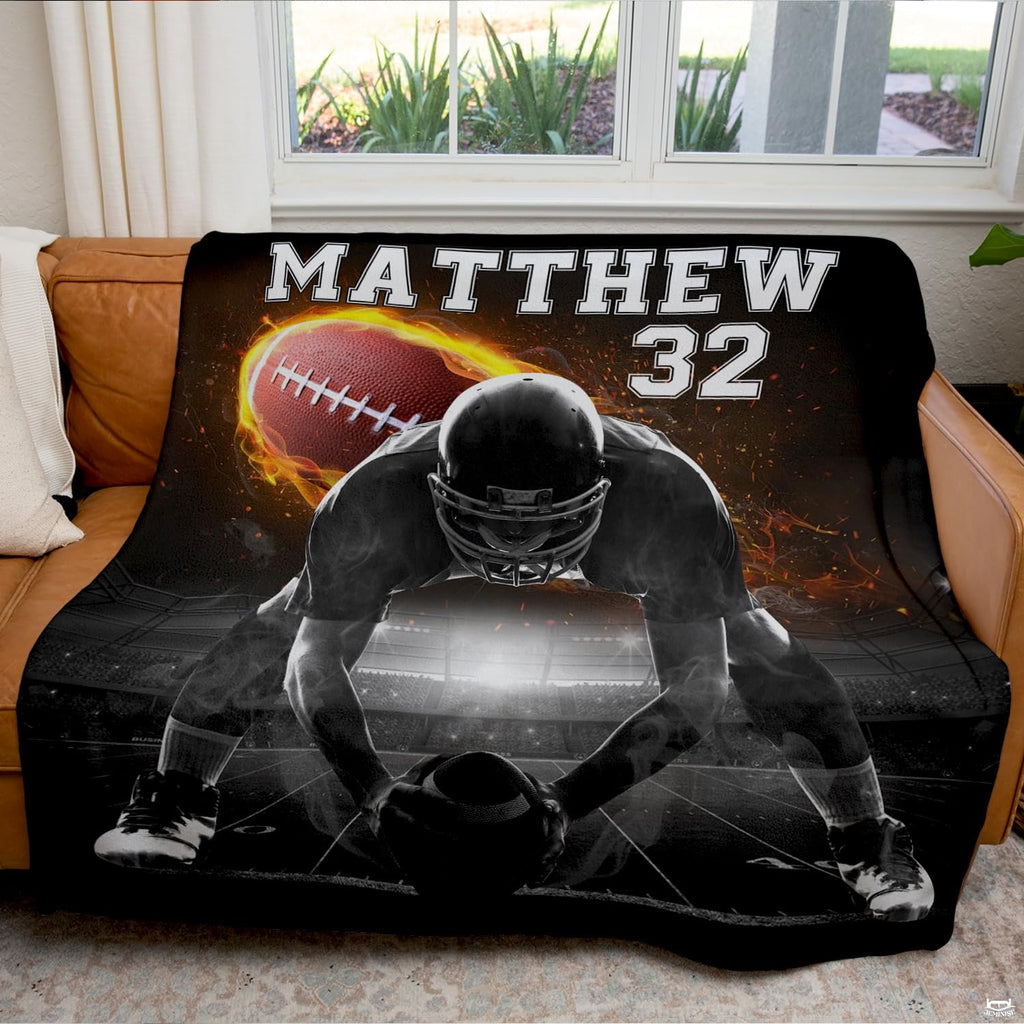 Football lineman throw blanket view 6 highlighting offensive center stance, flaming football, and stadium lights