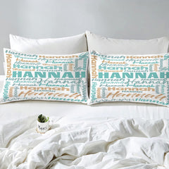 Overhead view of turquoise typography bedding spread across a contemporary bedroom bed