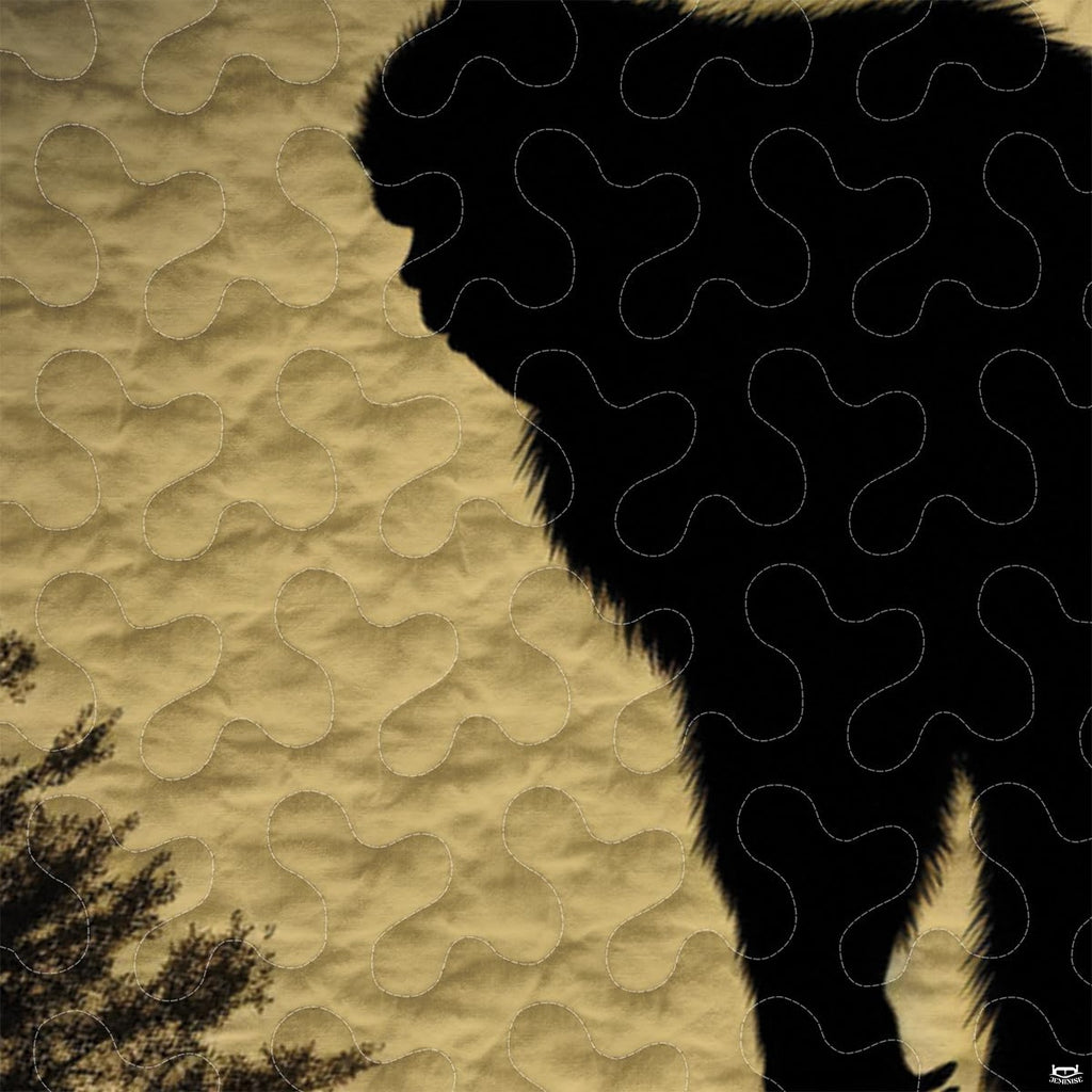 Close-up view of Bigfoot bedding showcasing vintage mustard gold tones, pine trees, and Sasquatch silhouette