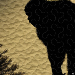 Close-up view of Bigfoot bedding showcasing vintage mustard gold tones, pine trees, and Sasquatch silhouette
