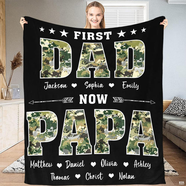 Full view of throw blanket displaying camouflage varsity block lettering, stars, and directional arrow graphics.