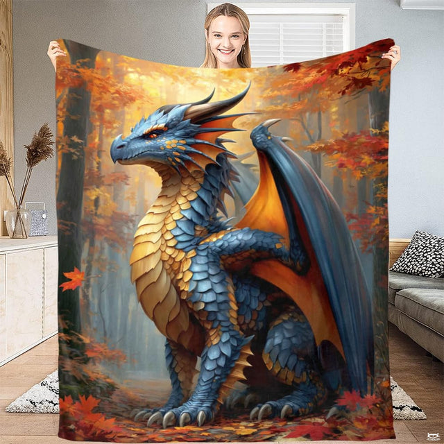 Blue dragon autumn forest fantasy throw blanket featuring horned dragon with golden wings among maples