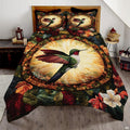 Autumn hummingbird bedding set with a gold medallion and dark botanical border