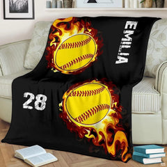 Fiery softball bedroom decor showcasing vivid yellow softballs enveloped in blazing orange flames against black.