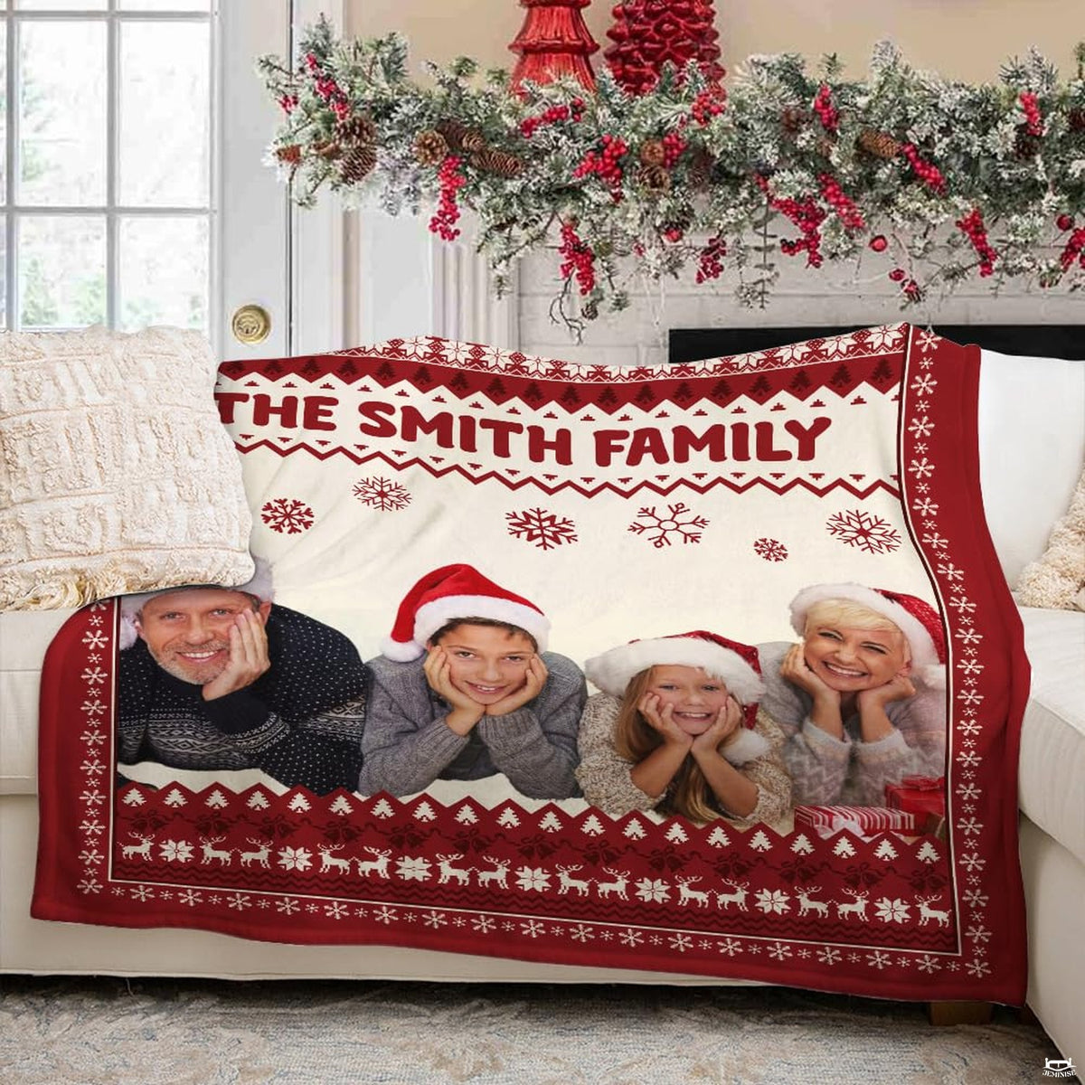 Holiday family graphic blanket styled across bedroom bed