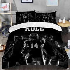 Close-up perspective of sports bedding detailing textured black football lacing and athletic collegiate typography