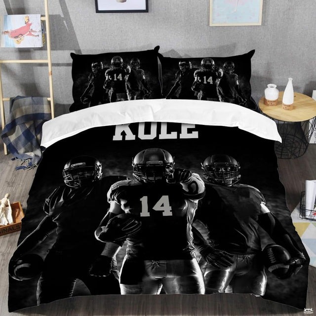 Close-up perspective of sports bedding detailing textured black football lacing and athletic collegiate typography