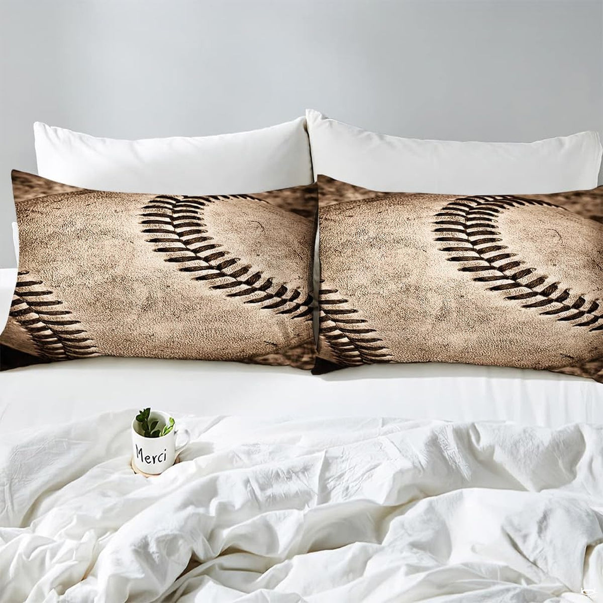 Side angle view of athletic sports bedding showing almond cream and espresso brown tones draped on mattress