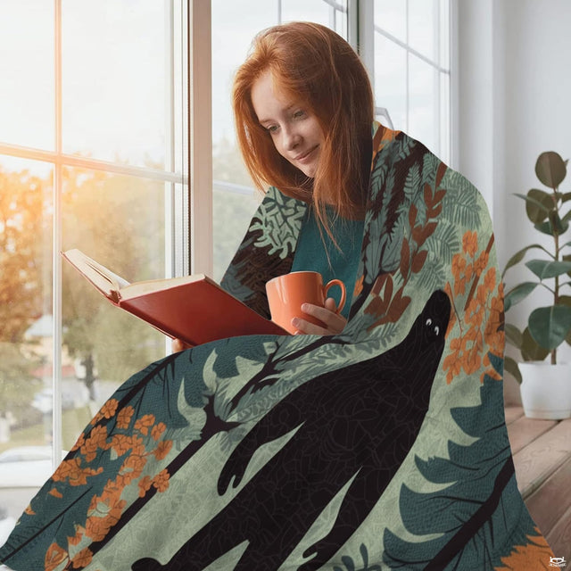 Close-up of woodland forest bed sheets illustration with textured ferns, pine branches, and warm ochre accents.