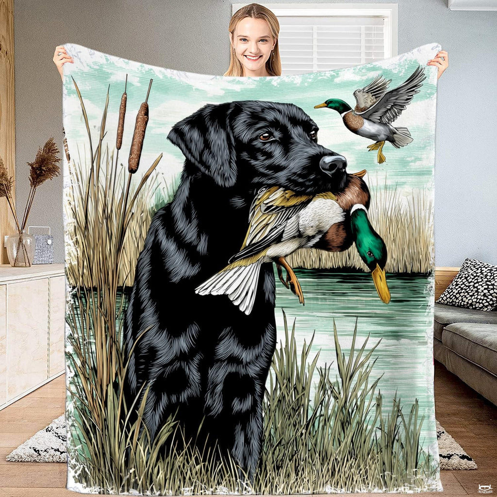 Black lab duck hunting bedding display featuring wetland retriever artwork and flying mallard drake on lake waters.