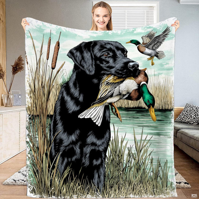 Black lab duck hunting bedding display featuring wetland retriever artwork and flying mallard drake on lake waters.