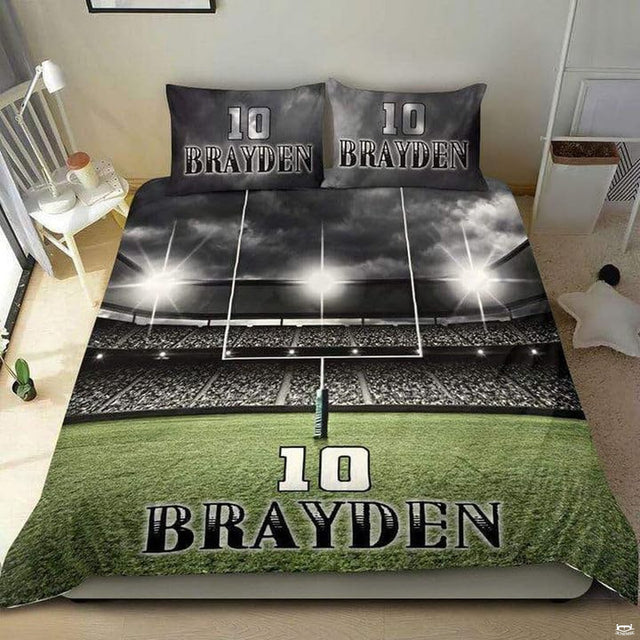 Championship gold football sports bedding featuring textured football graphic and yard lines on a bed