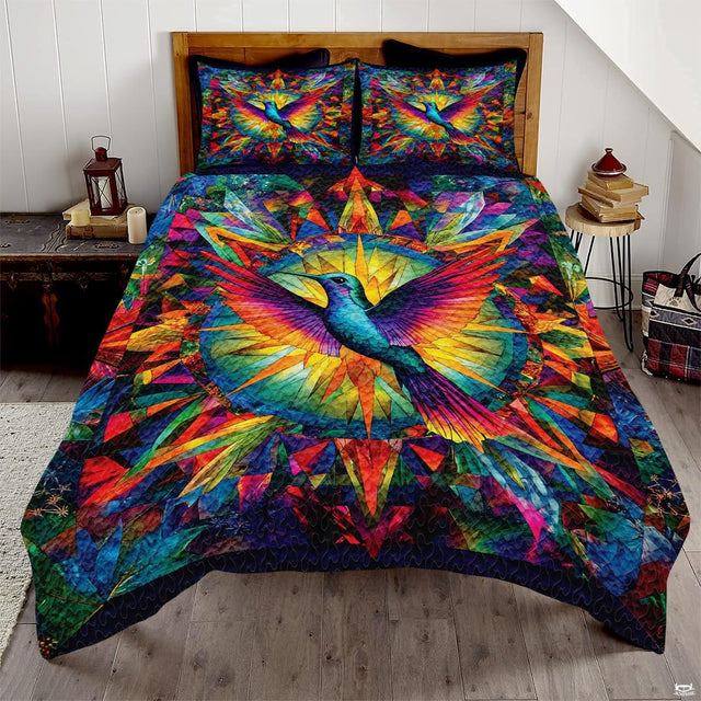 Blue hummingbird with magenta orange wings over a geometric circular burst