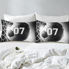 Folded corner detail showing inner batting structure beneath black and white soccer graphics.