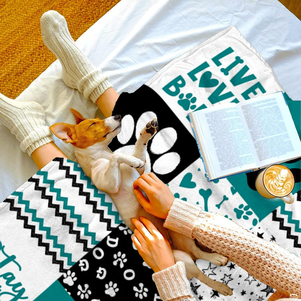 Teal dog paw print throw blanket view 5 highlighting patchwork pattern squares, bones, and stripes