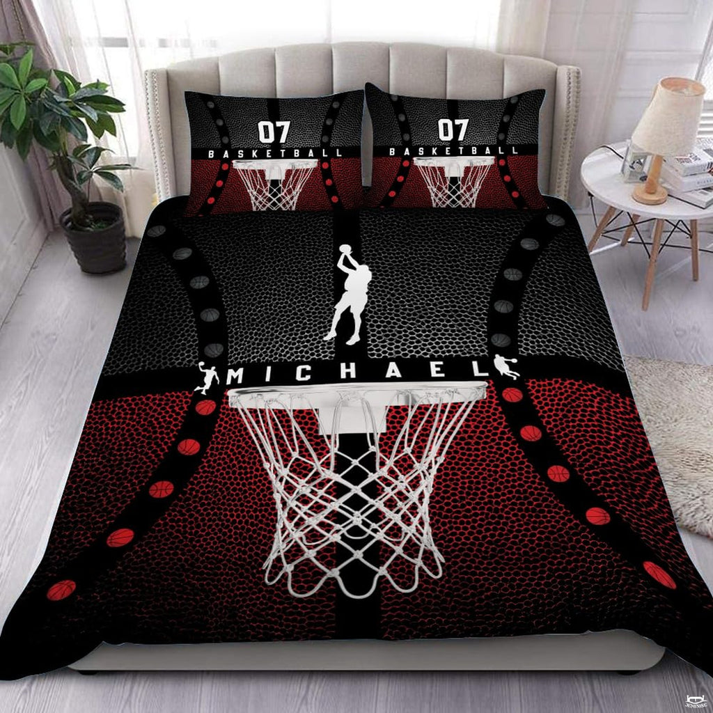 Red and black basketball sports bedding featuring hanging net and jump shooter silhouette on a modern bed