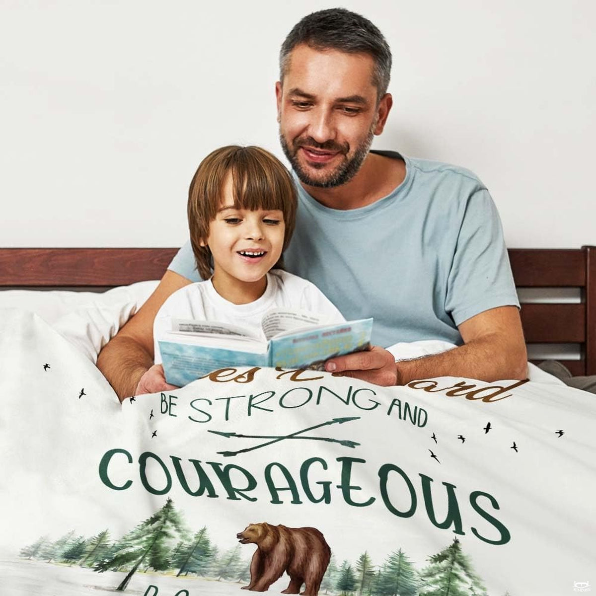 Artistic woodland bear bedding with rustic crossed arrows and evergreen tree scenery.