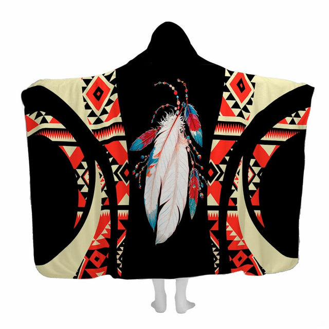 Southwestern bed covers displaying Aztec diamond patterns and native feathers in bold black, beige, and turquoise accents.