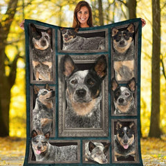 Outdoor view of a model holding up the full Australian Cattle Dog gallery throw blanket.