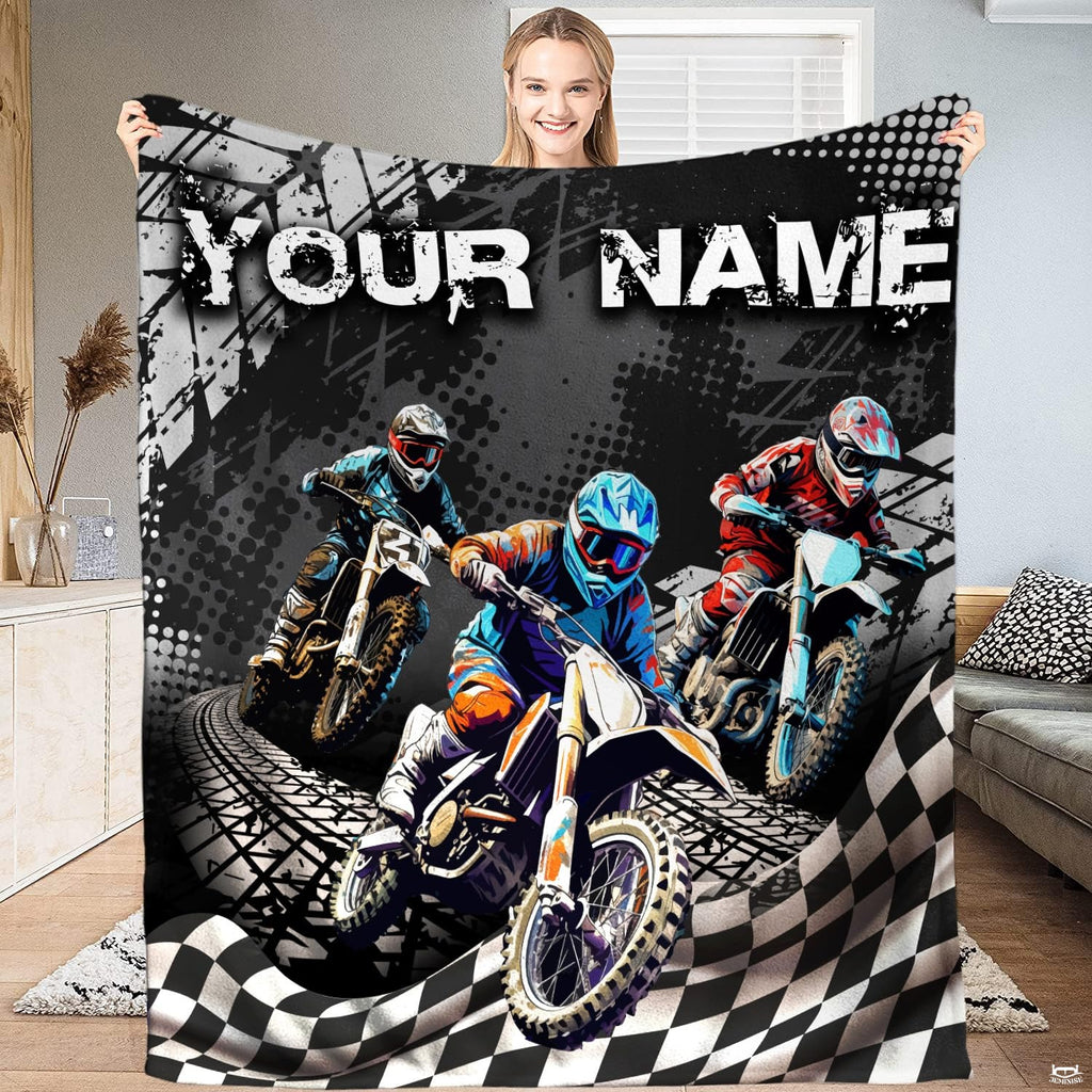 Motocross dirt bike racing throw blanket featuring three motorcycle racers and checkered flag graphics