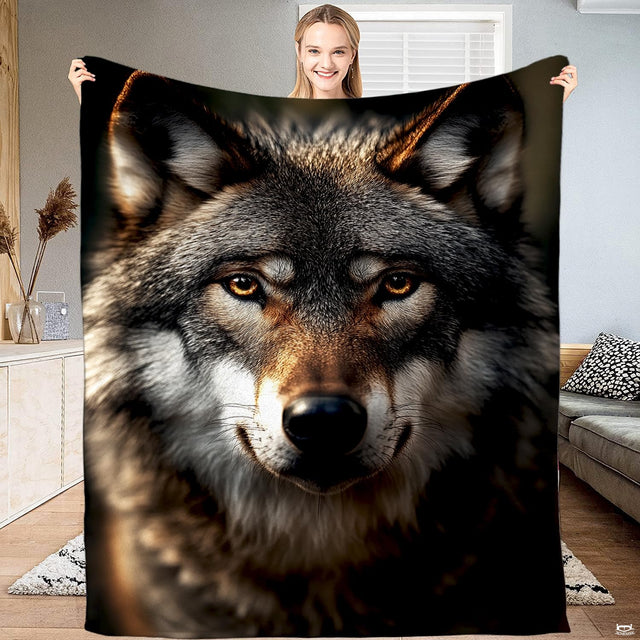 Timber wolf direct gaze portrait throw blanket showing close-up wolf face with amber eyes