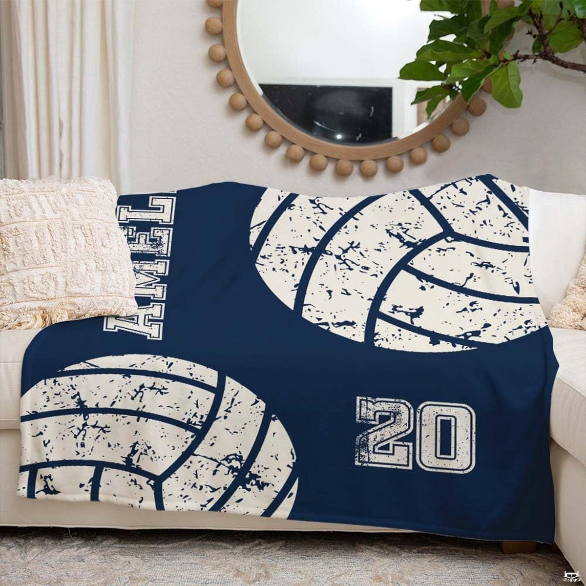 Overall bedroom display featuring navy sports bedding accented by vintage volleyball prints.