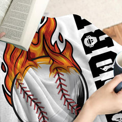 Bold athletic bedroom theme accented by vivid red baseball seam artwork and orange tones.