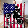 Dirt bike rider silhouette jumping over distressed American flag stars and stripes, view 1.
