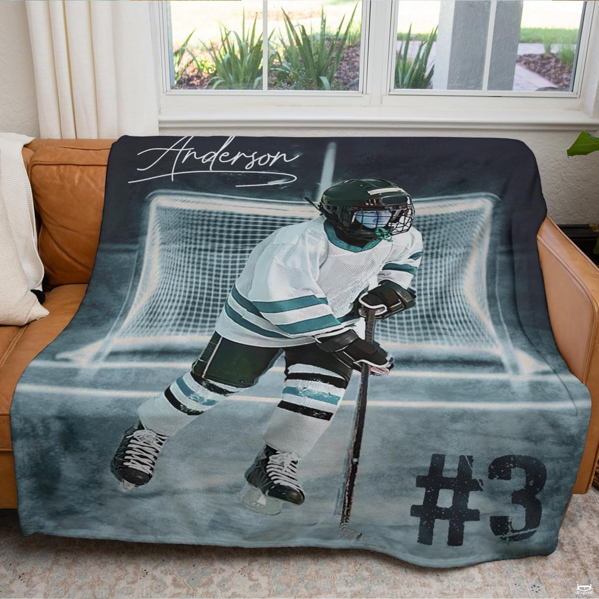 Youth ice hockey player sports blanket styled across bedroom bed