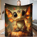 Cute baby dragon pumpkin butterfly throw blanket held open by woman