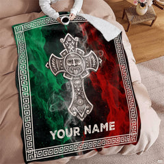 Angle view of Aztec cross throw blanket showing crisp edges and smoky flag backdrop