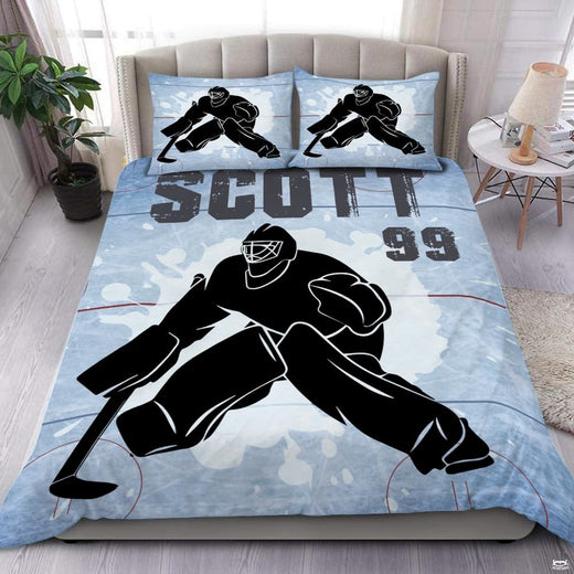 Steel blue ice hockey goalie sports bedding set featuring imposing goalkeeper graphics and scattering ice shards