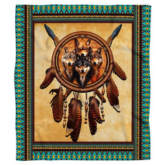 Close-up of wolf dreamcatcher artwork with crossed spears and turquoise tribal motifs on bedding.