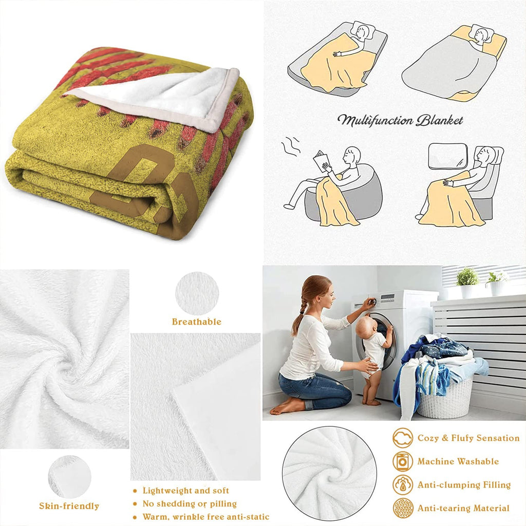 Neatly folded macro softball throw blanket displayed on wooden surface showcasing clean edge borders