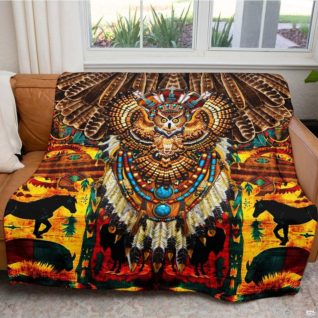 Ornamental owl design with turquoise stones on a tribal Indian bedding set.
