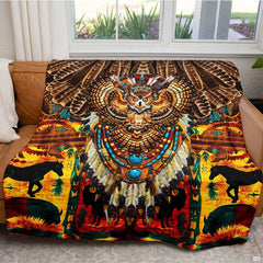 Ornamental owl design with turquoise stones on a tribal Indian bedding set.