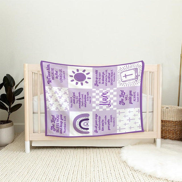 Purple faith scripture throw blanket draped across an armchair in a baby nursery