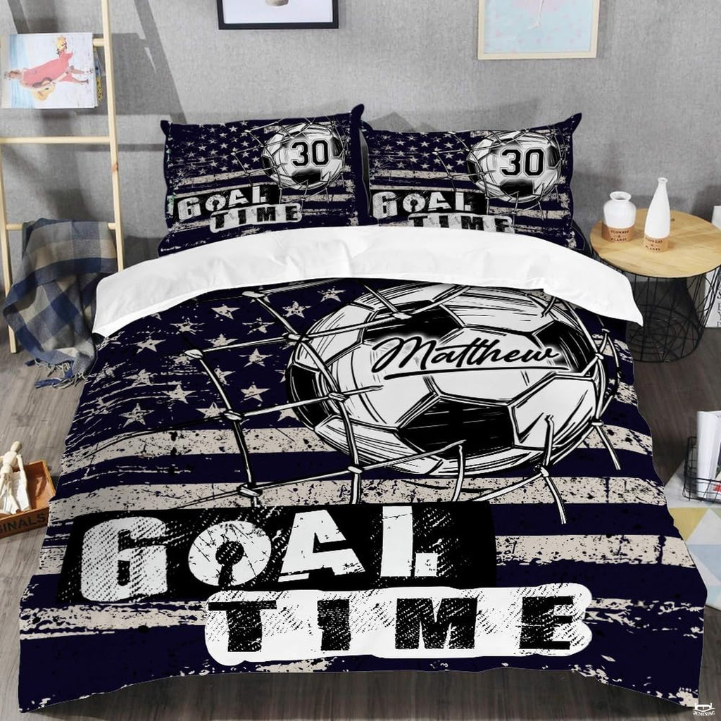 Close-up perspective of soccer bedding detailing goal net twine, ball pentagons, and collegiate typography