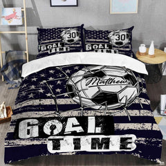 Close-up perspective of soccer bedding detailing goal net twine, ball pentagons, and collegiate typography