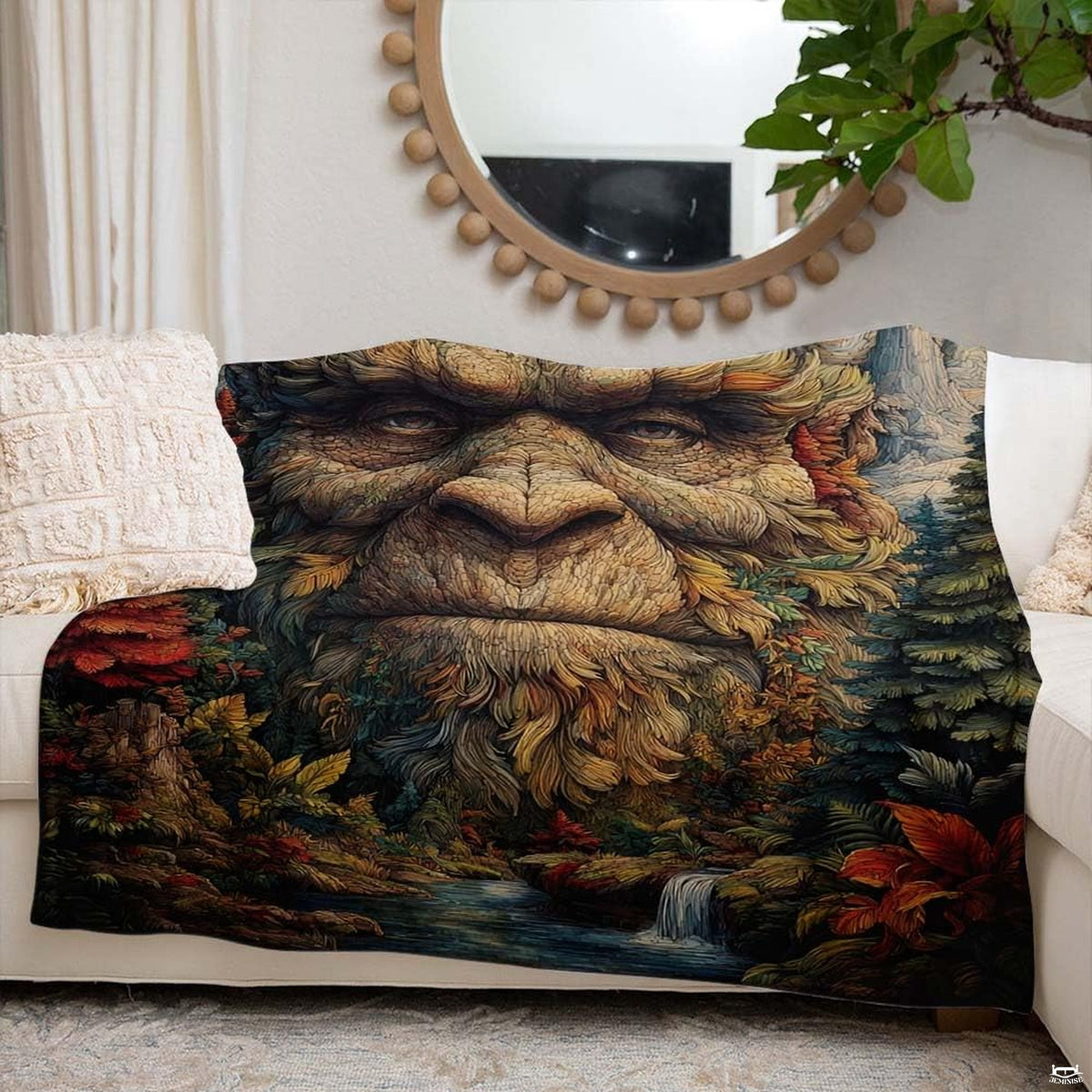 Bigfoot forest spirit throw blanket view 6 highlighting Sasquatch facial artwork and autumn woodland foliage
