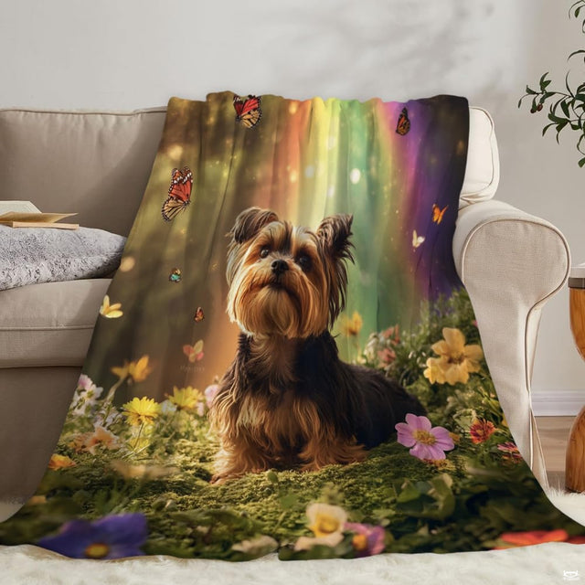 Yorkshire terrier dog in wildflower meadow beneath colorful rainbow and butterflies, view 2.