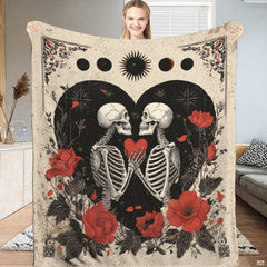 Dark romance bedding display showcasing skeleton lovers, gothic floral throw motifs, and celestial moon artwork.