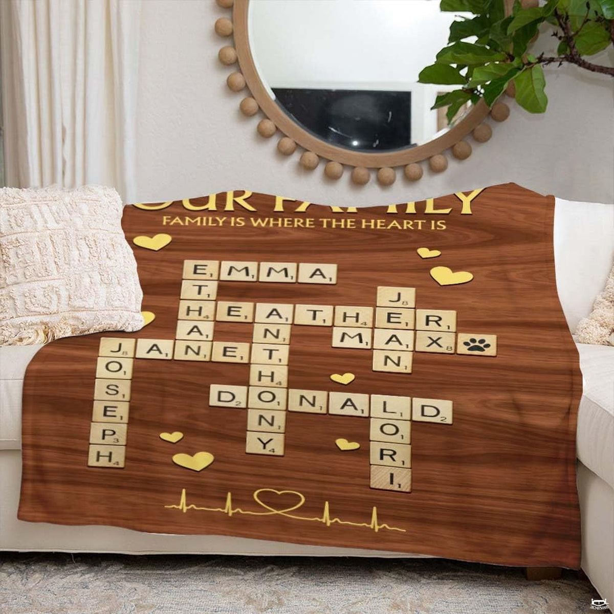 Living room sofa setting displaying crossword puzzle throw blanket draped across furniture.