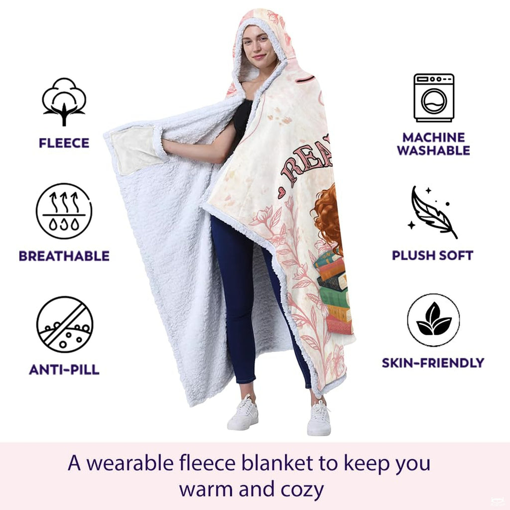 Close-up detail of floral bookworm throw blanket highlighting plush inner lining and graphic print