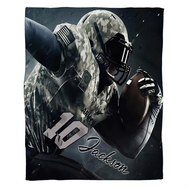 Flat view of camo football blanket displaying military uniform athlete charging forward on dark backdrop