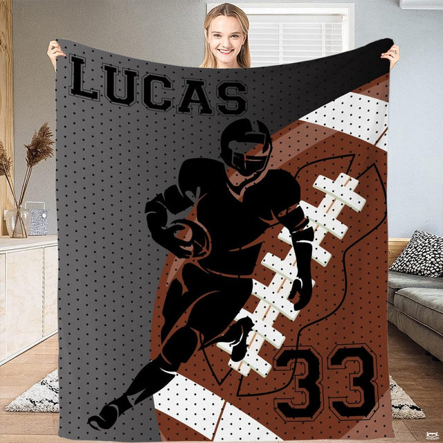 Football themed bed set featuring runner silhouette, yard lines, and bold athletic lettering in thematic accent brown.